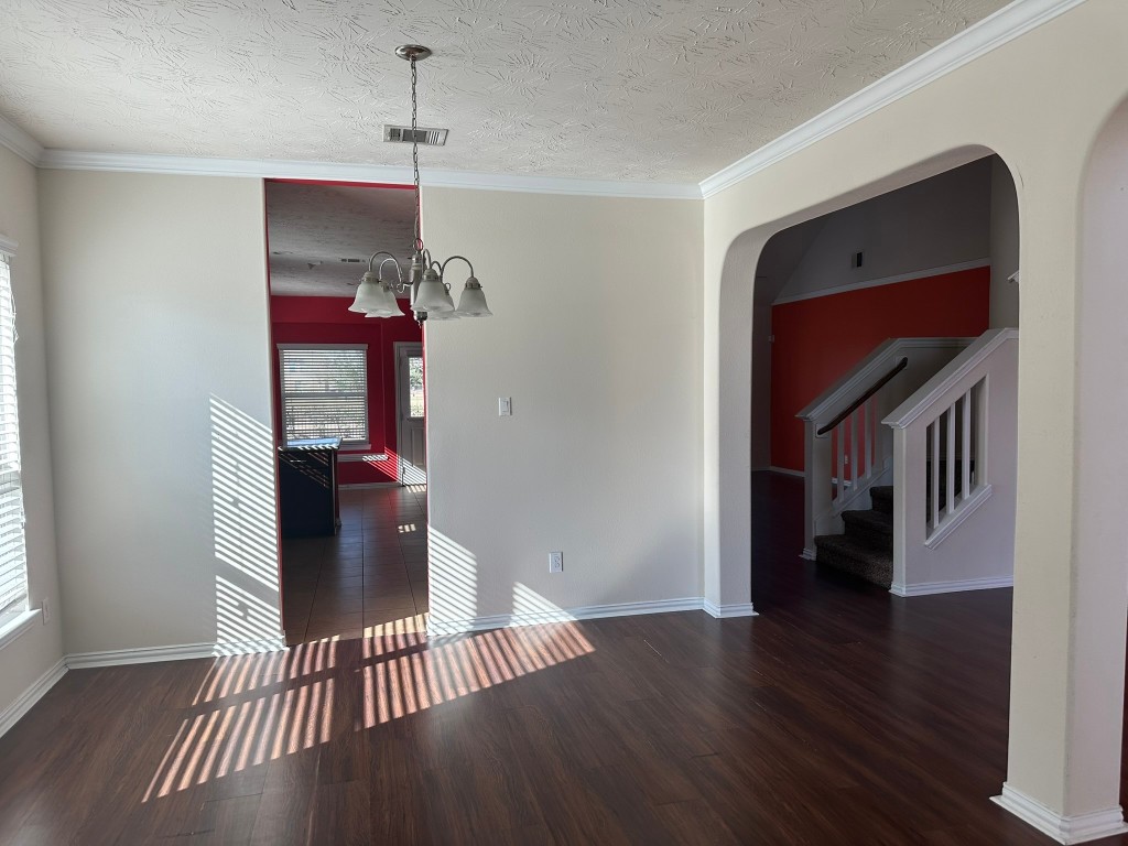 9914 Channel Set Way Rosharon, TX 77583 - Photo 4 of 24 a view of a hallway with wooden floor and staircase