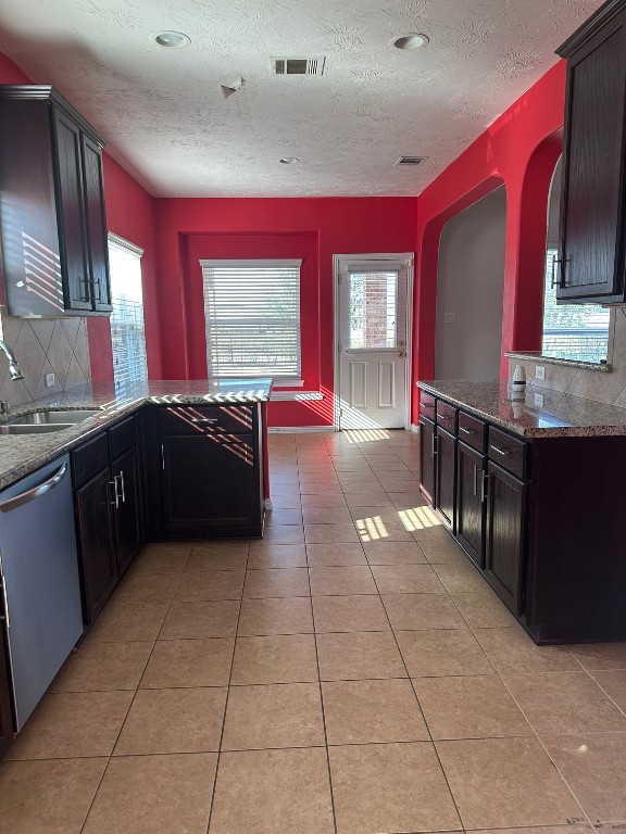 9914 Channel Set Way Rosharon, TX 77583 - Photo 5 of 24 a large kitchen with stainless steel appliances a sink and cabinets