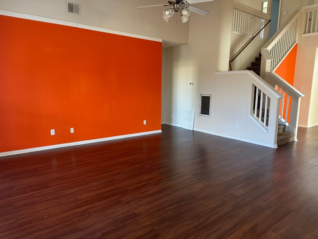 9914 Channel Set Way Rosharon, TX 77583 - Photo 7 of 24 a view of an empty room with wooden floor and a window