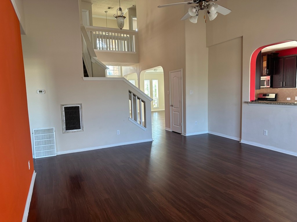 9914 Channel Set Way Rosharon, TX 77583 - Photo 8 of 24 wooden floor in an empty room with a window