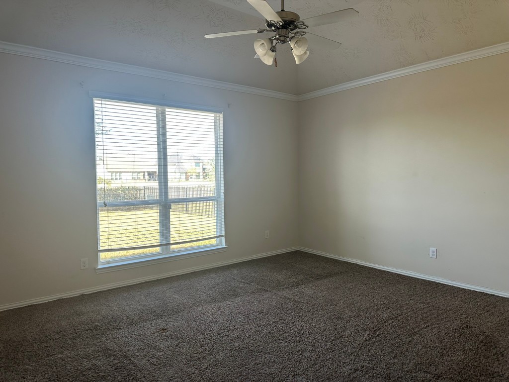 9914 Channel Set Way Rosharon, TX 77583 - Photo 9 of 24 a view of an empty room with a window