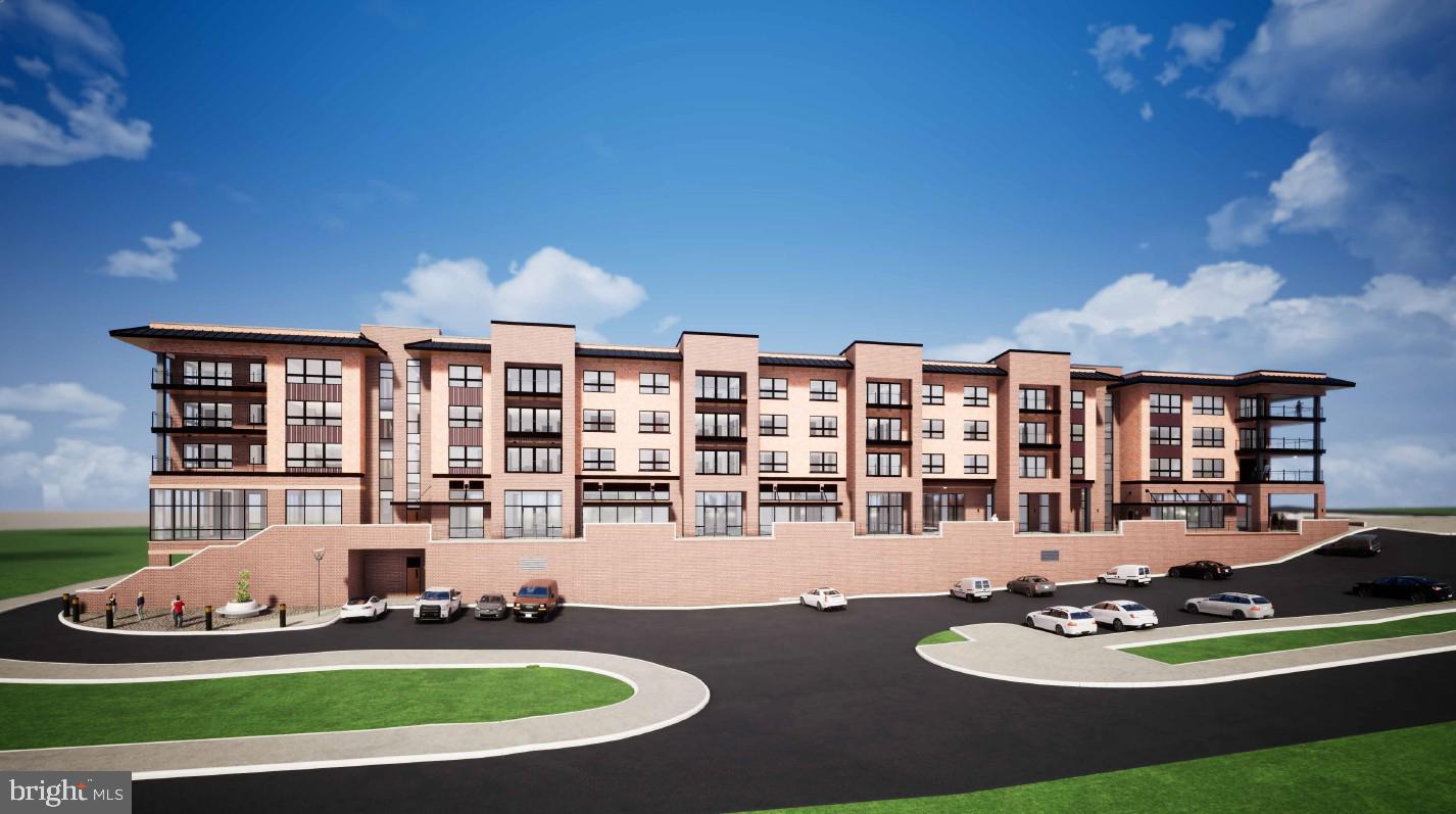 Walker Drive, Unit A104 Warrenton, VA 20186 - Photo 9 of 13 a table and chairs in front of a white house