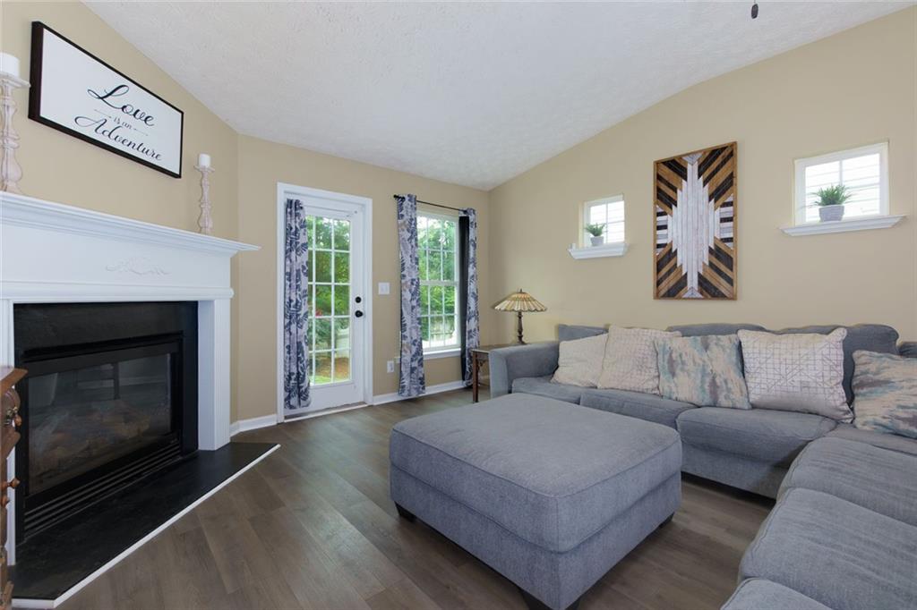 67 Granite Court Dallas, GA 30132 - Photo 12 of 27 a living room with furniture and a fireplace
