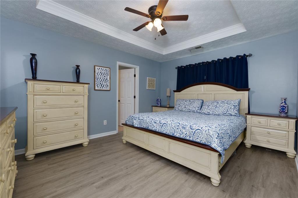 67 Granite Court Dallas, GA 30132 - Photo 13 of 27 a bedroom with a bed and a dresser