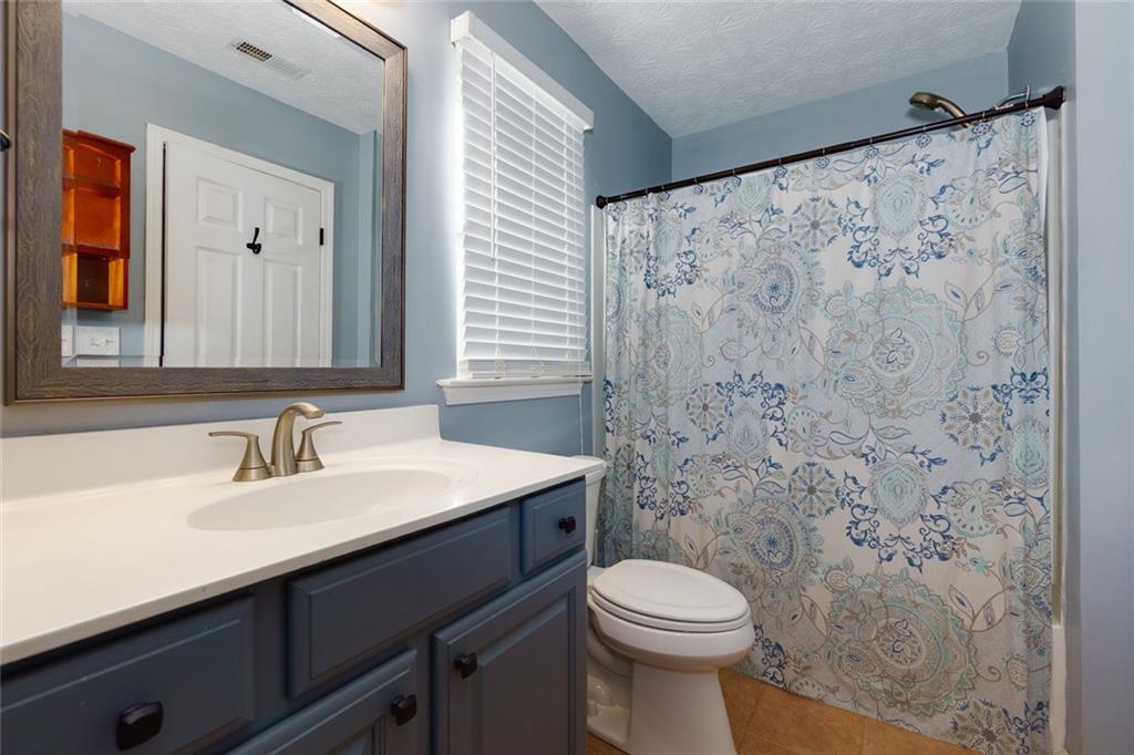 67 Granite Court Dallas, GA 30132 - Photo 16 of 27 a bathroom with a sink and a mirror