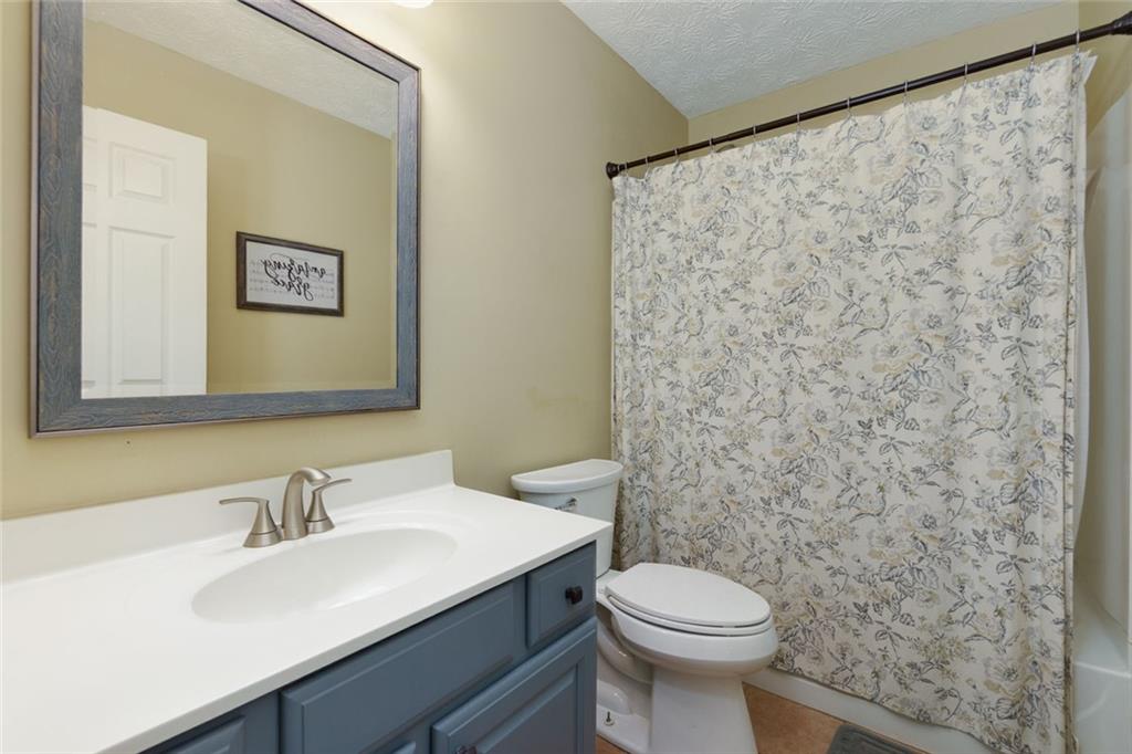 67 Granite Court Dallas, GA 30132 - Photo 17 of 27 a bathroom with a sink and a toilet