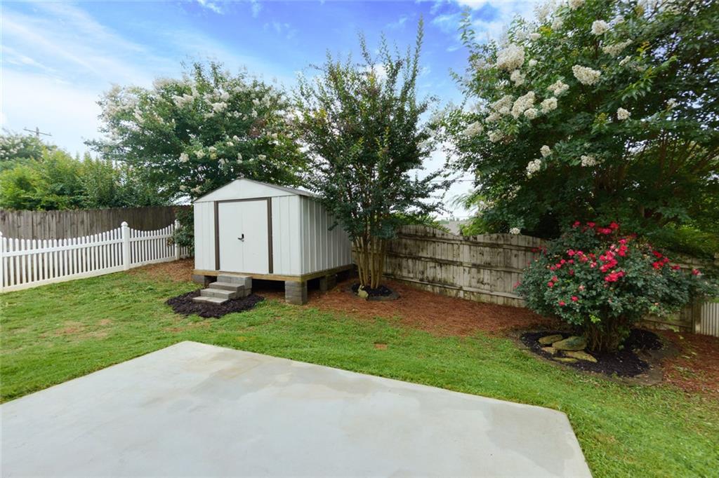 67 Granite Court Dallas, GA 30132 - Photo 21 of 27 a backyard of a house with lots of green space