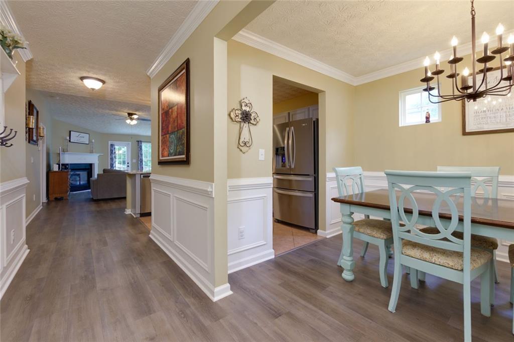 67 Granite Court Dallas, GA 30132 - Photo 3 of 27 a view of a kitchen with furniture and wooden floor