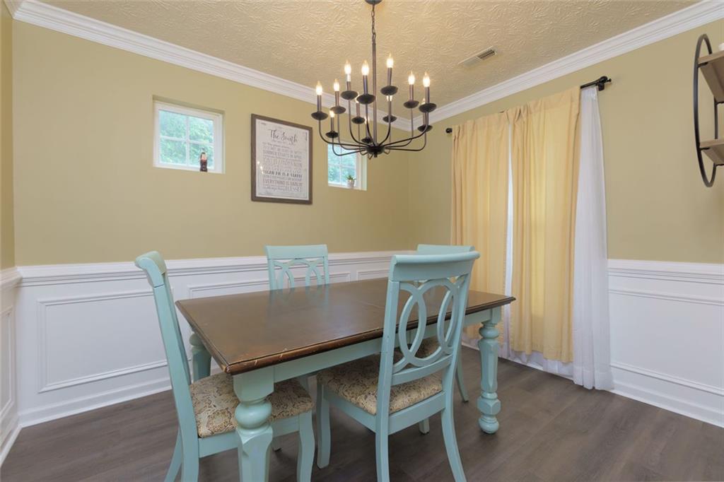 67 Granite Court Dallas, GA 30132 - Photo 4 of 27 a view of a dining room with furniture and chandelier