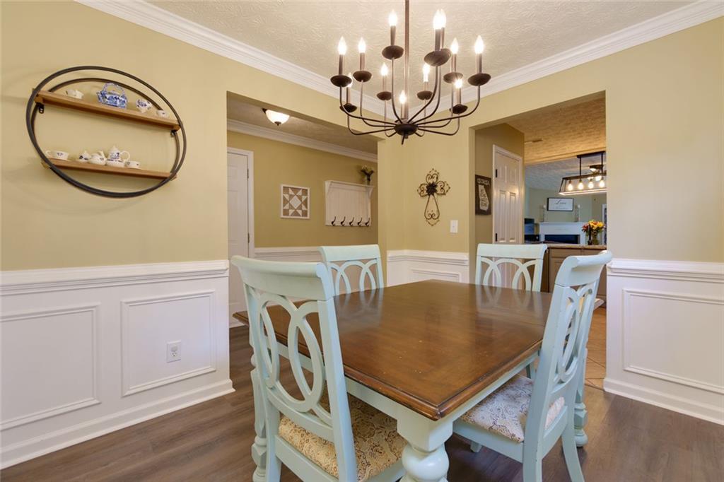 67 Granite Court Dallas, GA 30132 - Photo 5 of 27 a view of a dining room with furniture and a chandelier