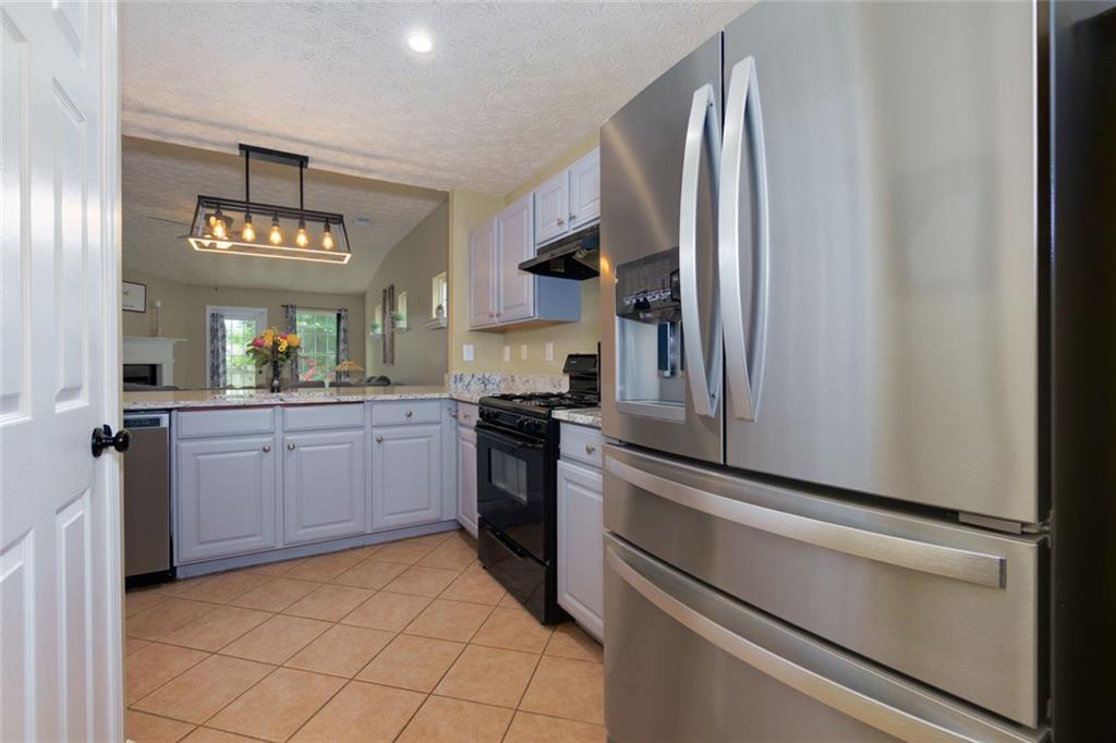 67 Granite Court Dallas, GA 30132 - Photo 6 of 27 a kitchen with a refrigerator and cabinets
