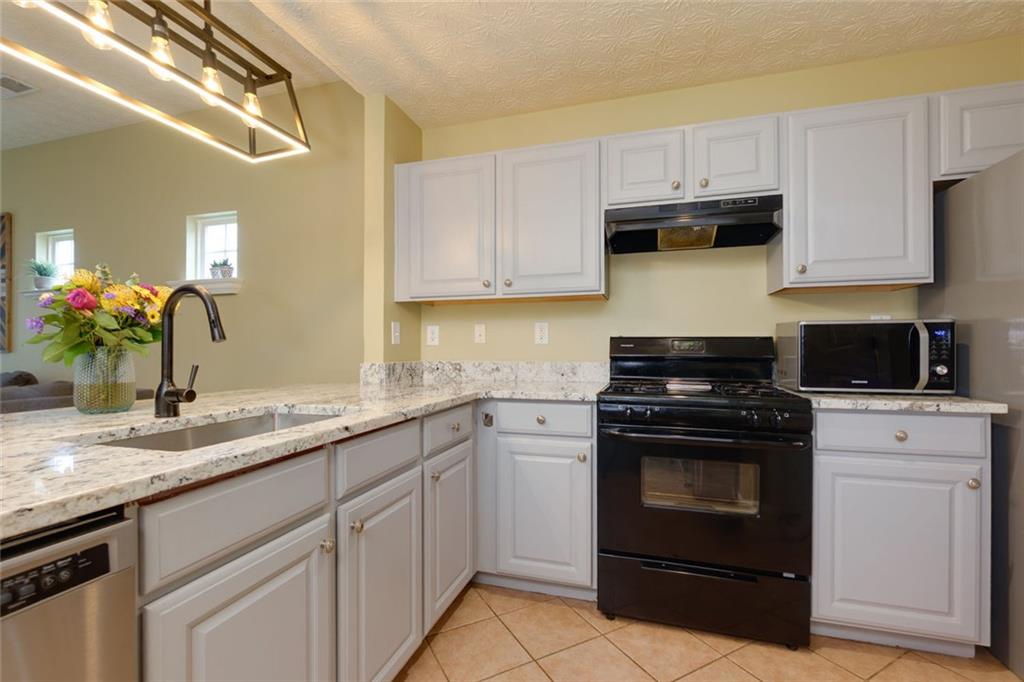 67 Granite Court Dallas, GA 30132 - Photo 9 of 27 a kitchen with cabinets appliances and a sink