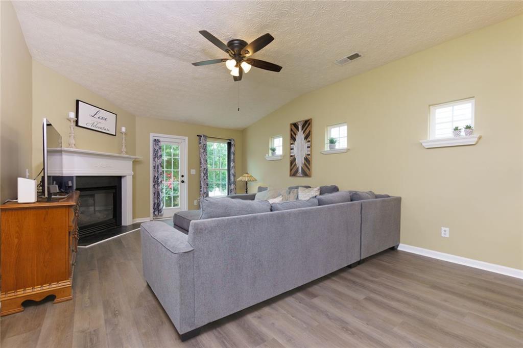67 Granite Court Dallas, GA 30132 - Photo 10 of 27 a living room with furniture and a fireplace