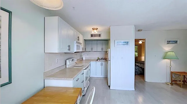 a kitchen with a sink cabinets and counter space