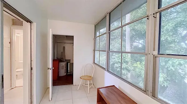 a view of a room with a large window