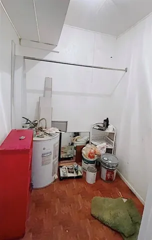 a dining room with furniture window and wooden floor