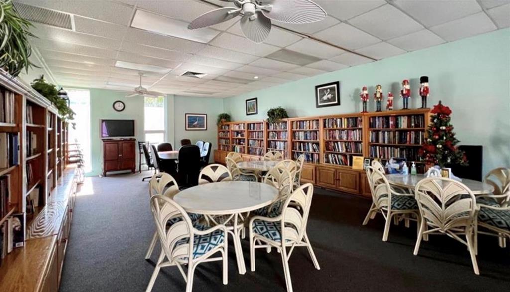 1200 Colonnades Drive, Unit 208 Fort Pierce, FL 34949 - Photo 27 of 31 a dining room with furniture window and wooden floor