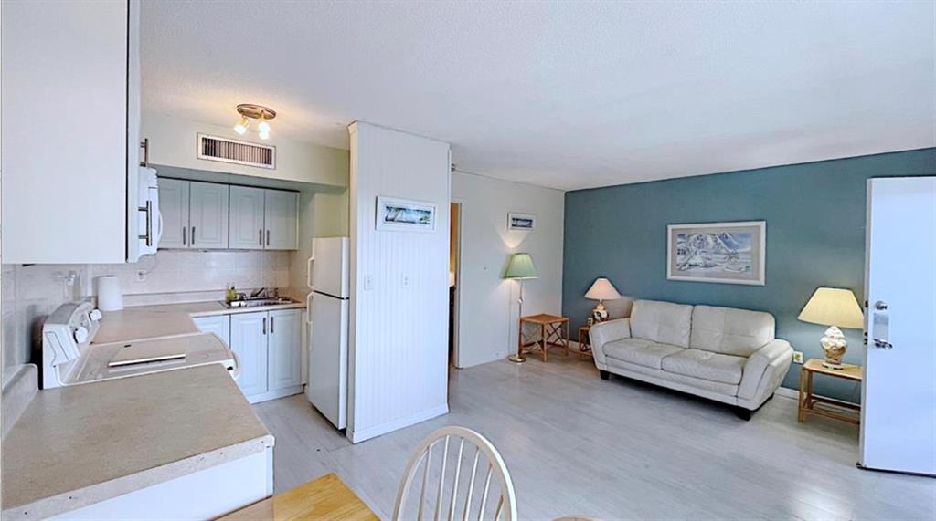 1200 Colonnades Drive, Unit 208 Fort Pierce, FL 34949 - Photo 7 of 31 a living room with furniture and a couch