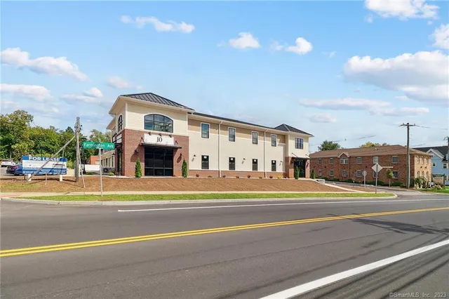 a view of a big building next to a road