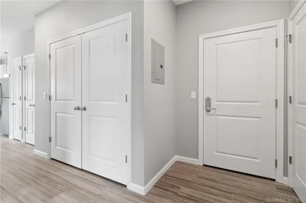 a view of a closet area with entryway