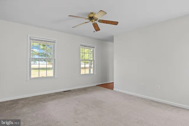 a stove top oven sitting inside of a kitchen