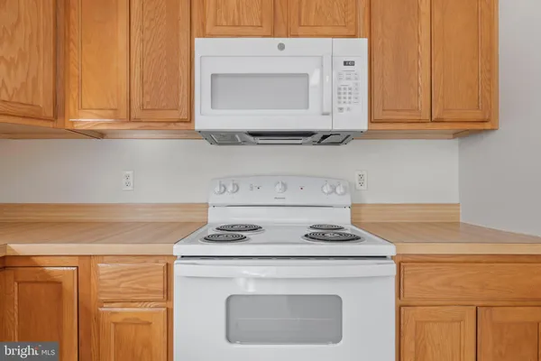 a kitchen with a refrigerator and a sink
