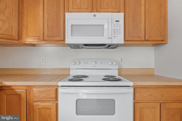 a kitchen with a refrigerator and a sink