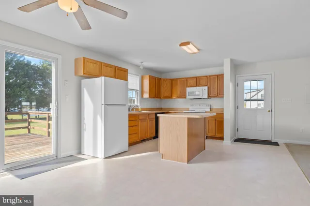 a bathroom with a sink toilet and a mirror