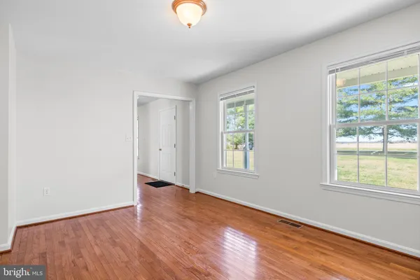 a bathroom with a sink toilet and a mirror