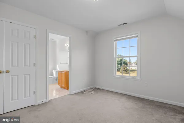 a bathroom with a shower and a glass door