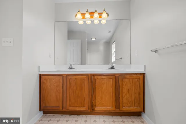 an aerial view of residential houses with outdoor space and lake view