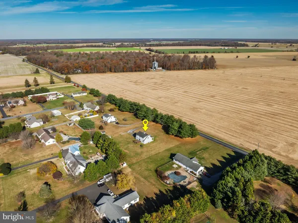 an aerial view of a house with a lake view
