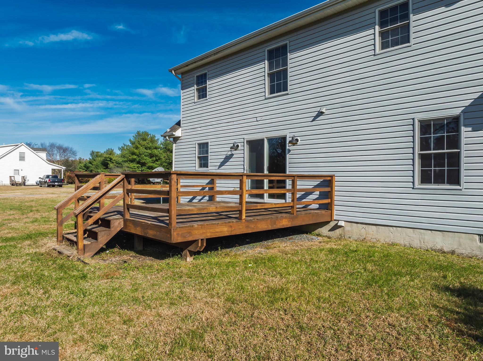 8578 Tuckahoe Road Denton, MD 21629 - Photo 58 of 64 a backyard of a house with wooden fence and roof