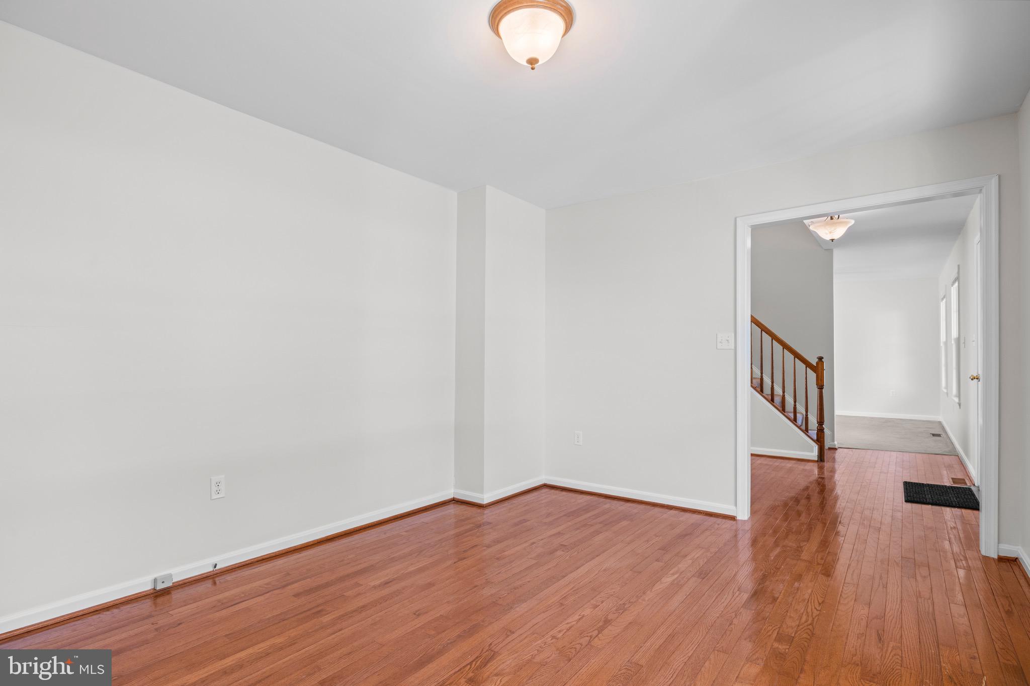 8578 Tuckahoe Road Denton, MD 21629 - Photo 6 of 64 a view of a room with wooden floor and staircase