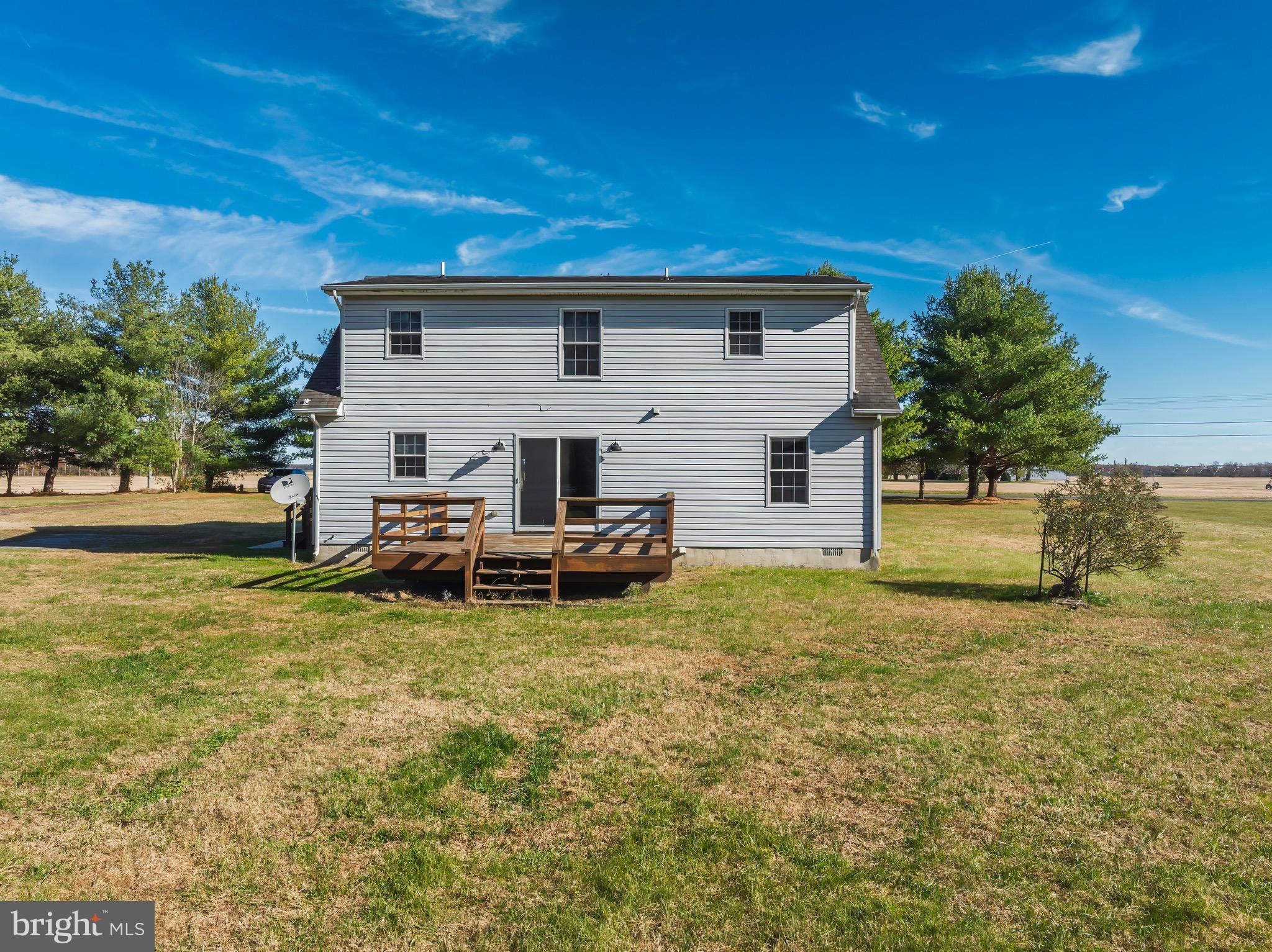 8578 Tuckahoe Road Denton, MD 21629 - Photo 62 of 64 a view of a house with backyard and a tree