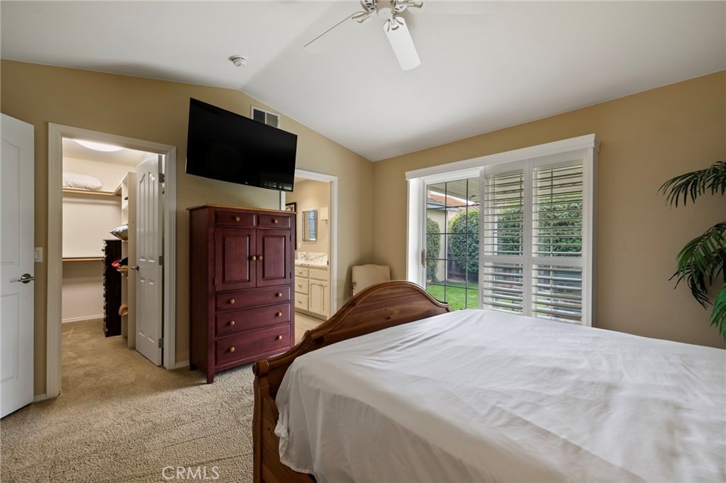 554 Andrea Circle Paso Robles, CA 93446 - Photo 15 of 34 a bedroom with a bed and a flat screen tv