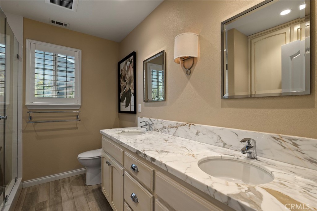 554 Andrea Circle Paso Robles, CA 93446 - Photo 16 of 34 a bathroom with a granite countertop sink toilet and mirror