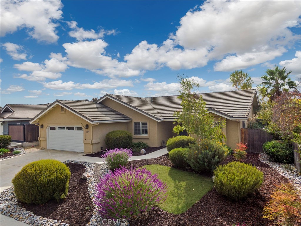 554 Andrea Circle Paso Robles, CA 93446 - Photo 2 of 34 a view of a house with a big yard and potted plants