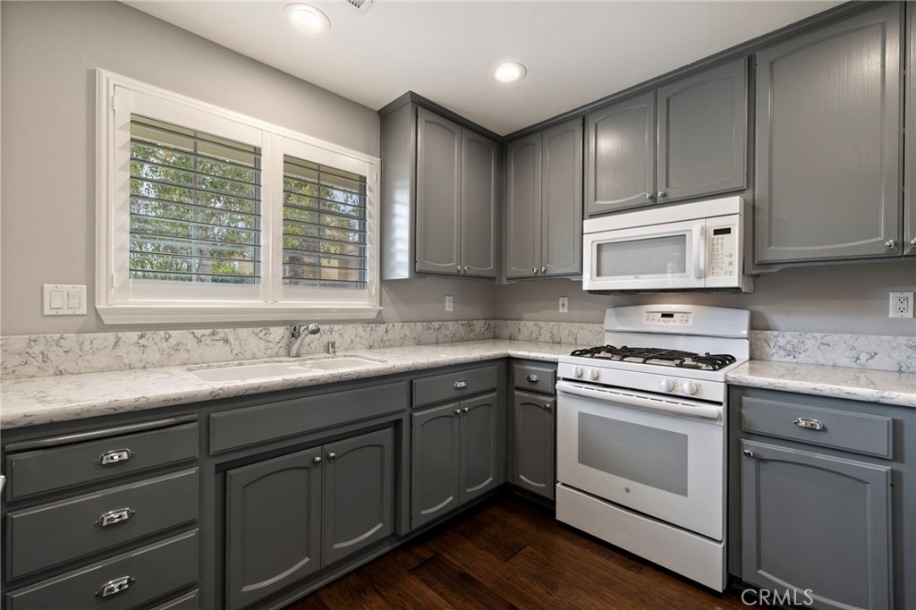 554 Andrea Circle Paso Robles, CA 93446 - Photo 10 of 34 a kitchen with stainless steel appliances granite countertop a sink a stove and cabinets