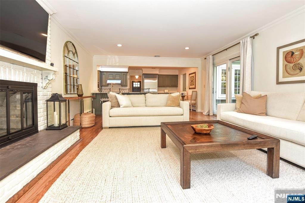 60 Dimmig Road Upper Saddle River, NJ 07458 - Photo 23 of 40 a living room with furniture and a fireplace