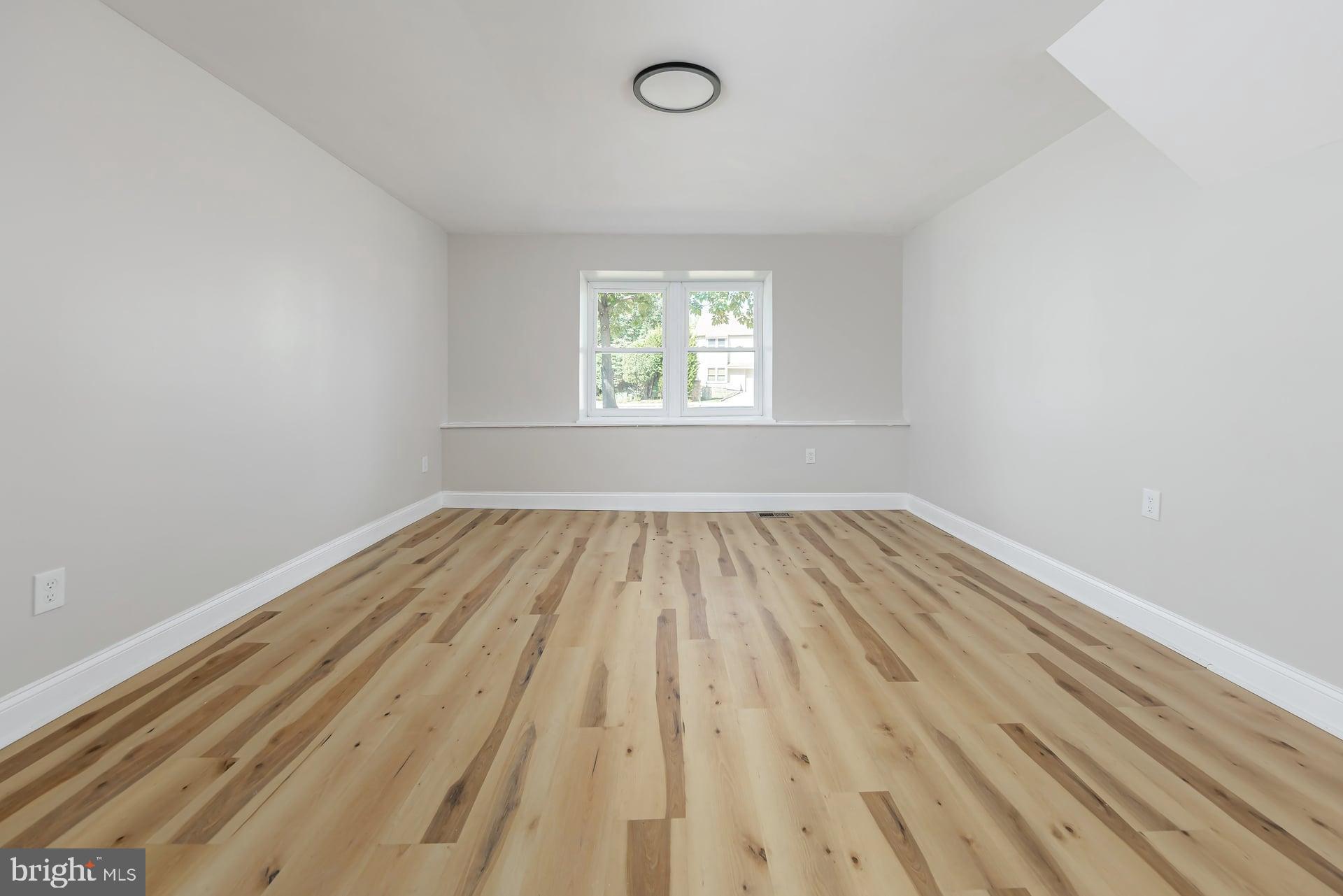 31 Quince Court Mount Laurel, NJ 08054 - Photo 11 of 21 an empty room with wooden floor and windows