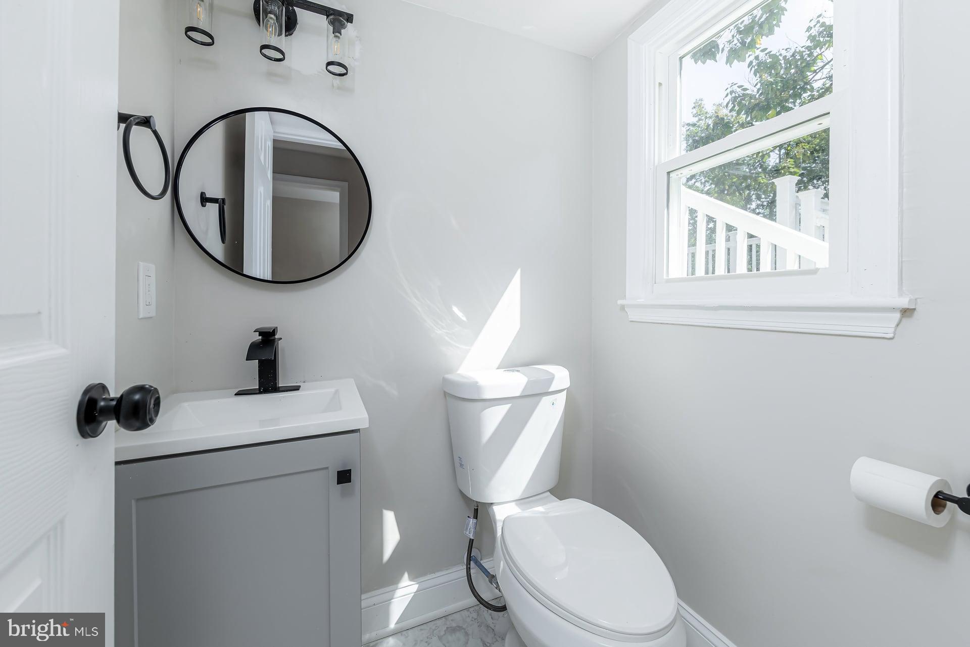 31 Quince Court Mount Laurel, NJ 08054 - Photo 16 of 21 a white toilet sitting next to a bathroom sink