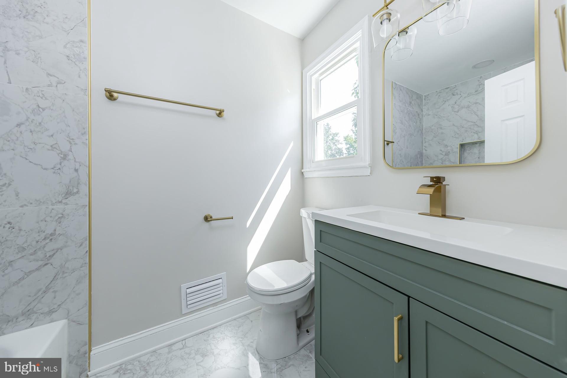 31 Quince Court Mount Laurel, NJ 08054 - Photo 17 of 21 a bathroom with a sink a toilet a window and vanity