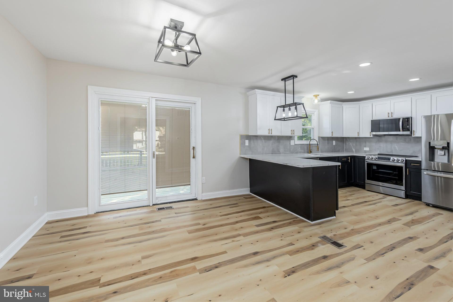 31 Quince Court Mount Laurel, NJ 08054 - Photo 4 of 21 a kitchen with stainless steel appliances granite countertop a sink and cabinets