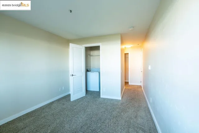 a view of hallway with a bathroom