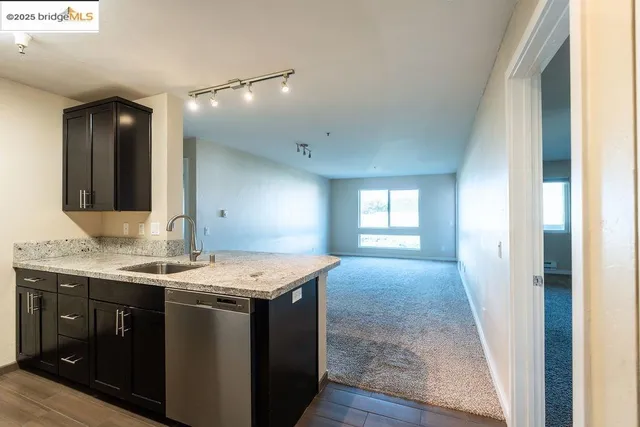 a kitchen with a sink stove and microwave