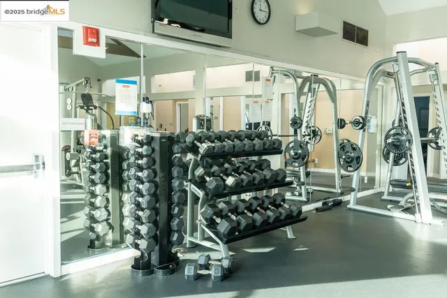 a room with pool table and windows