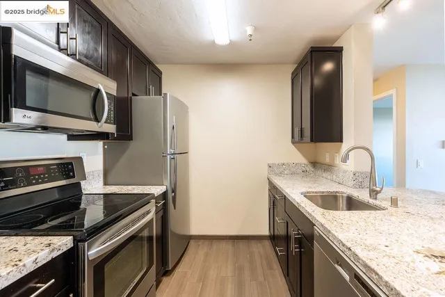 a kitchen with a sink stove and microwave