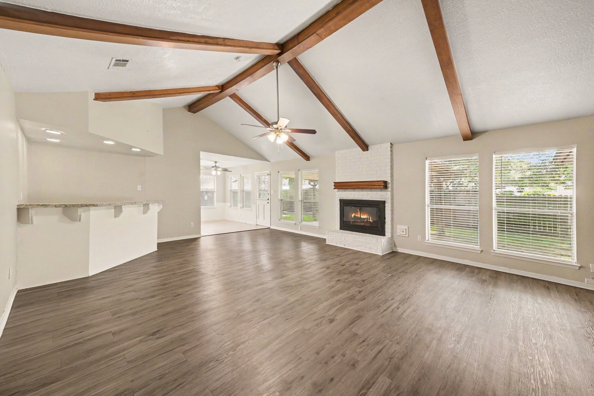 17419 Cassina Drive Spring, TX 77388 - Photo 11 of 35 a view of an empty room with wooden floor and a window