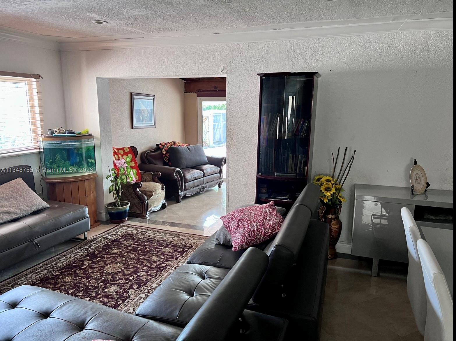 9970 Southwest 30th Street Miami, FL 33165 - Photo 2 of 3 a living room with furniture